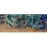 A vintage policeman’s bicycle and a ladies Raleigh bike.