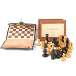 A Staunton boxwood and ebonised hardwood chess set, king 7cm high, contained in original sliding lid