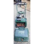 An Atco Balmoral petrol lawnmower.