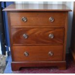 An antique mahogany three drawer chest with fluted decoration, 80cm by 76cm by 48cm together with an