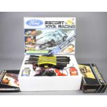 A vintage boxed Scalextric Ford Escort XR3i racing set together with a boxed Scalextric lap
