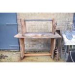 An oak table and matching bench, in solid oak slab form.