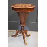 A 19th century rosewood and burrwood veneered games / work table, the octagonal top inlaid with a