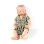 An early 20th century Kammer and Reinhardt "Kaiser" baby doll, bisque head, composition jointed body