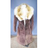 A vintage ladies fur lined brown suede coat with a belt and buttons, size 46.