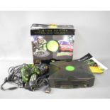 A retro Limited Edition XBOX, in original box along with controllers and manuals.