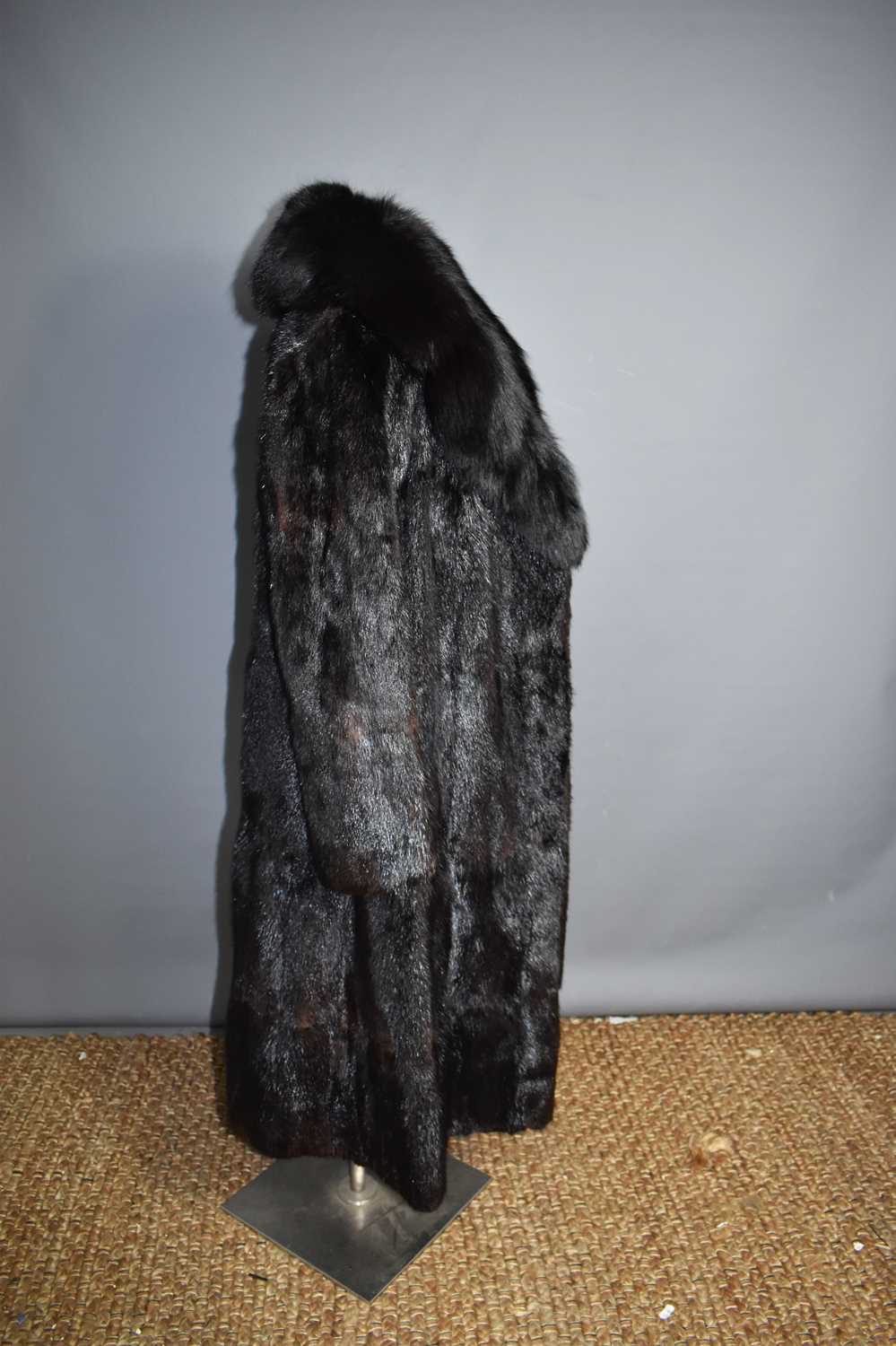 A 1970's black mink coat, together with a champagne coloured mink, a jacket, a fur collar and two - Image 2 of 10