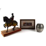 A resin model of a medieval war horse and knight raised on a wooden base together with a Japanese