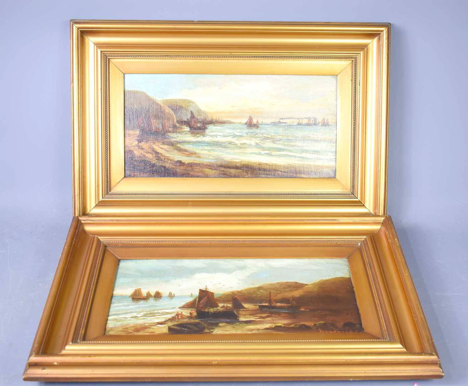 A pair of 19th century style marine landscapes, depicting sailing vessels in coastal waters, both