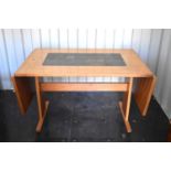 A Mid-Century Gangso Mobler, tile top extending dining table together with four modern chairs.