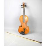 A late 19th century "Carrodus" violin by Hawks & Co, two piece back, with bow, 36.5cm back.