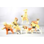 A group of ceramic dog ornaments to include Sylvac 1379, Szeiler, Coopercraft, Royal Copenhagen