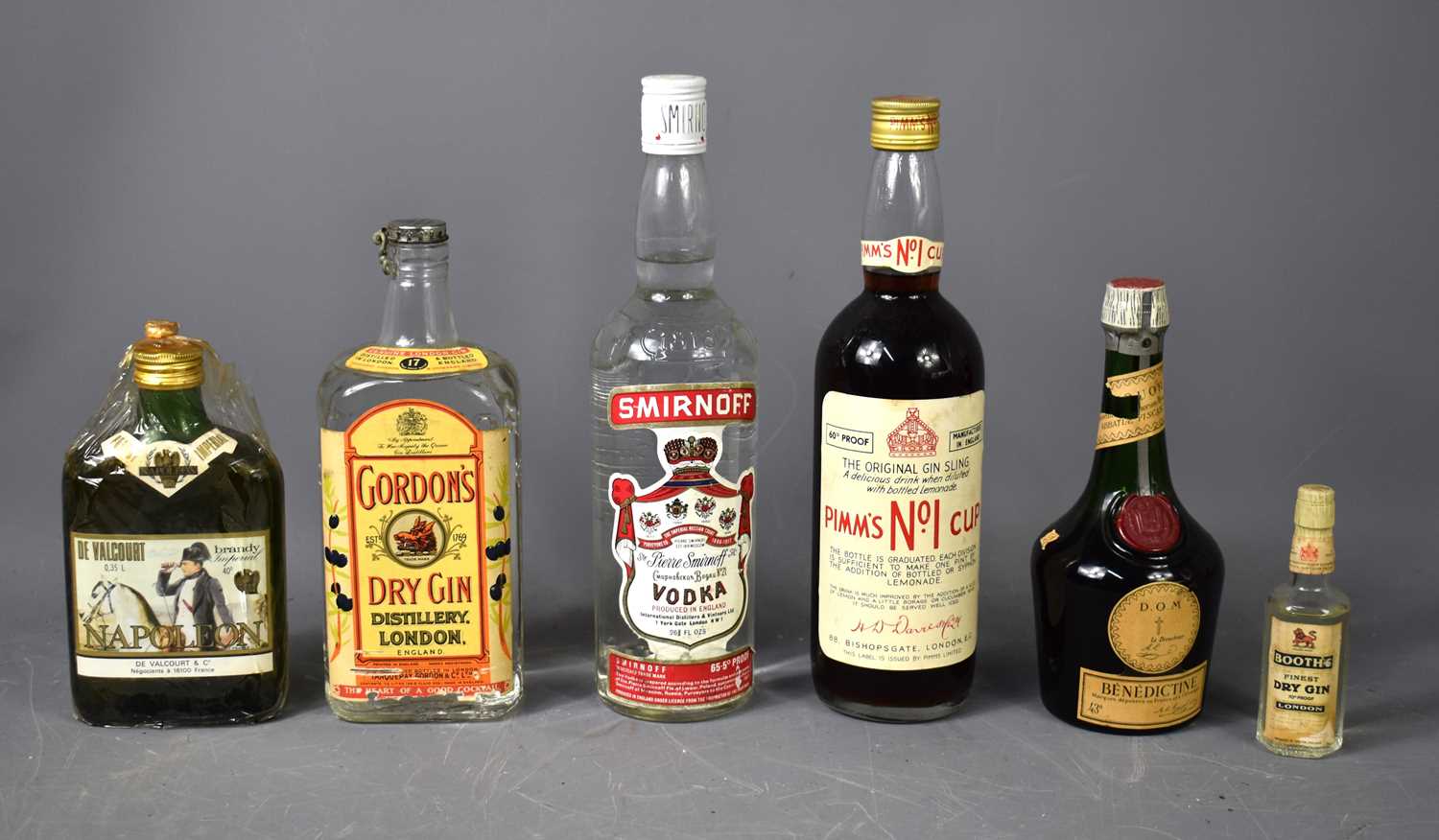 A group of liqueurs and spirits to include a bottle of vintage D.O.M Benedictine liqueur, Pimm's No1