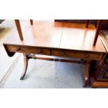 A mahogany sofa table with two slim drawers, drop leaf sides and columns united by a turned single