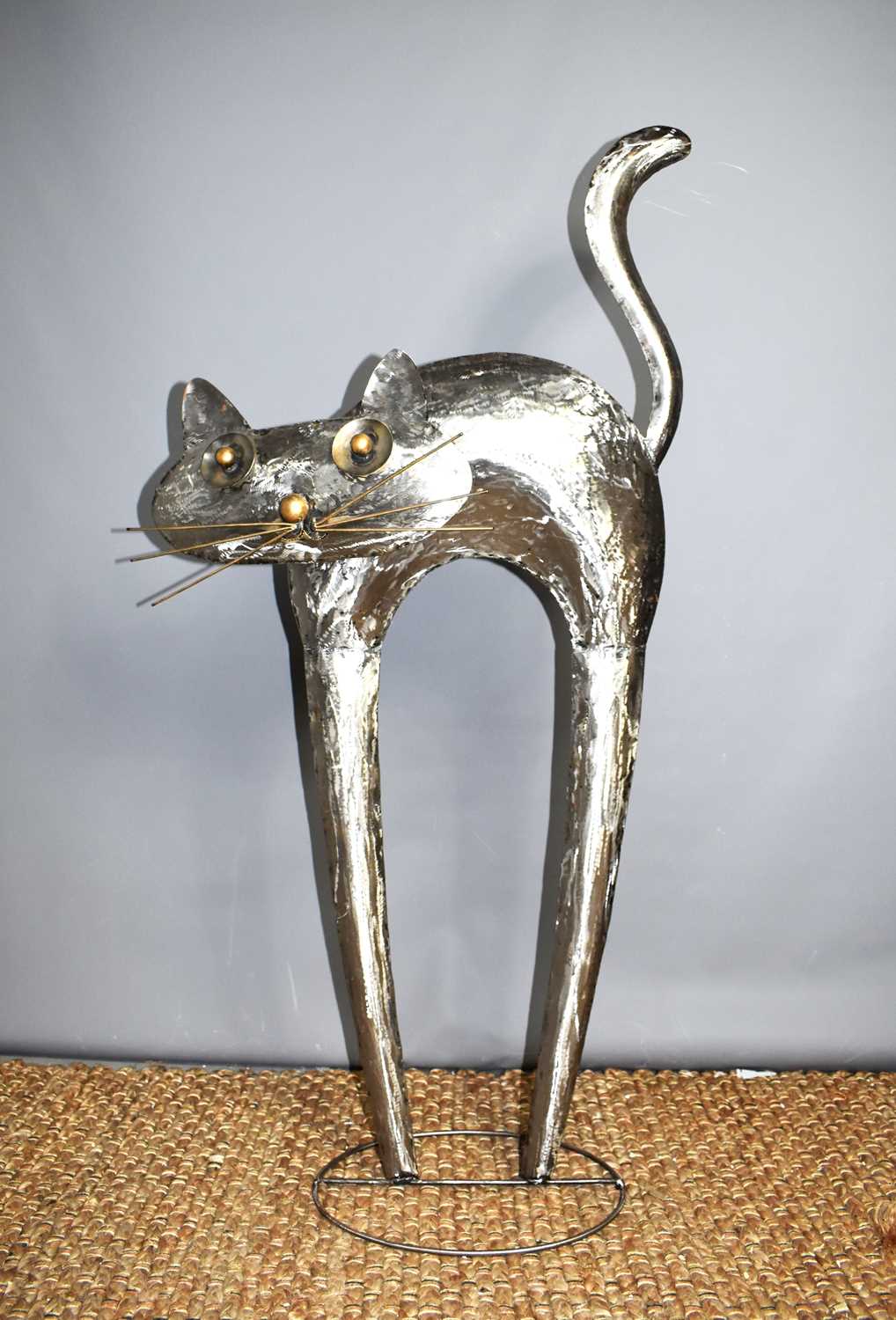 A large steel and mixed metal sculpture of a cat, apparently unsigned, 119cm high.