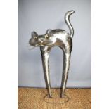 A large steel and mixed metal sculpture of a cat, apparently unsigned, 119cm high.