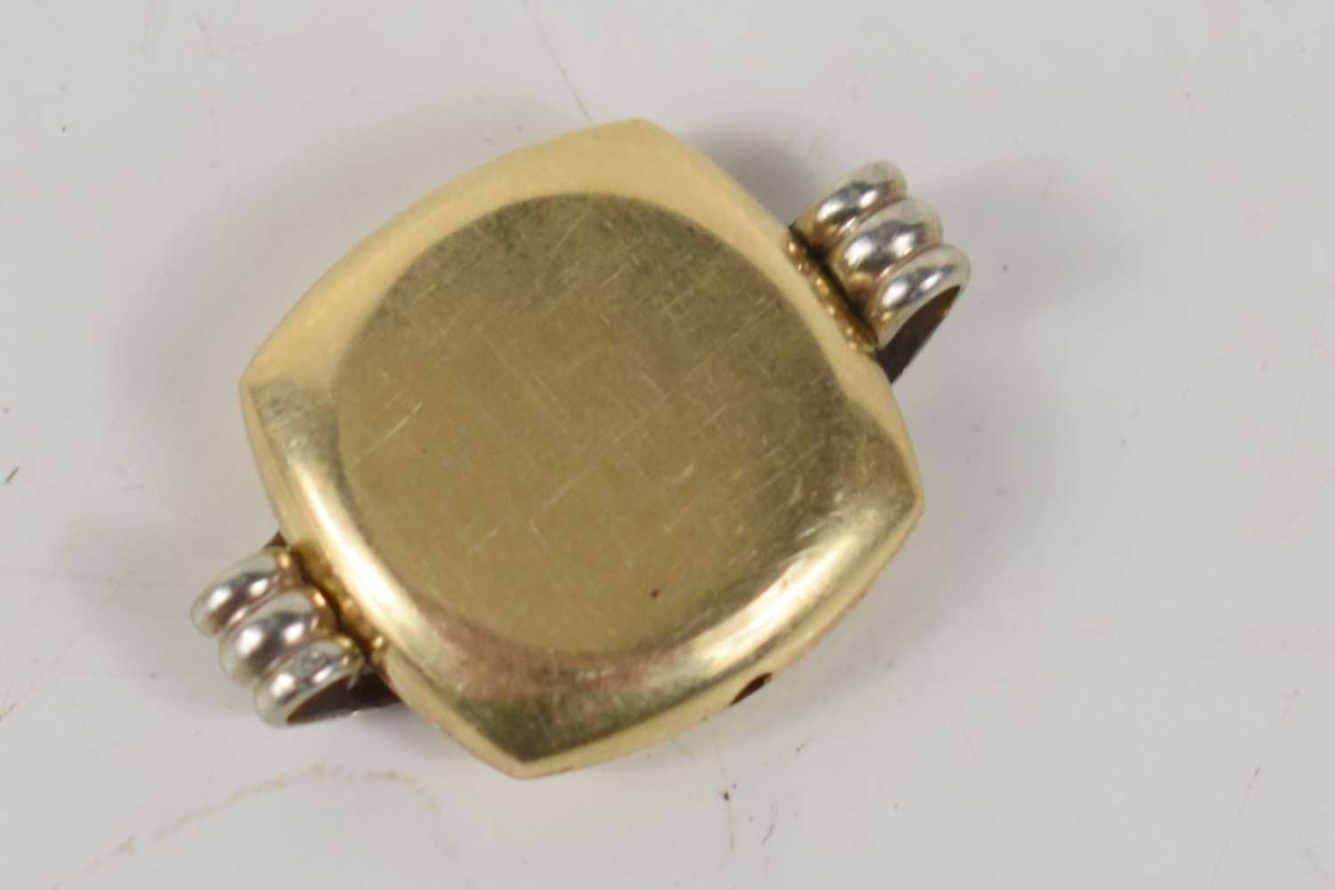 A 14ct gold watch case, 3.2g.