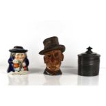 An Ally Sloper figurative tobacco jar, a pewter oval tobacco jar, and a further tobacco jar, all