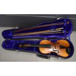 A cased violin and two bows.