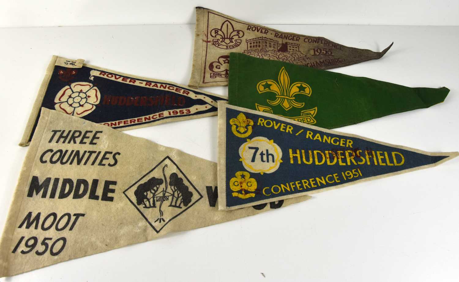 A group of vintage Scouts and Girl Guides conference pennants.