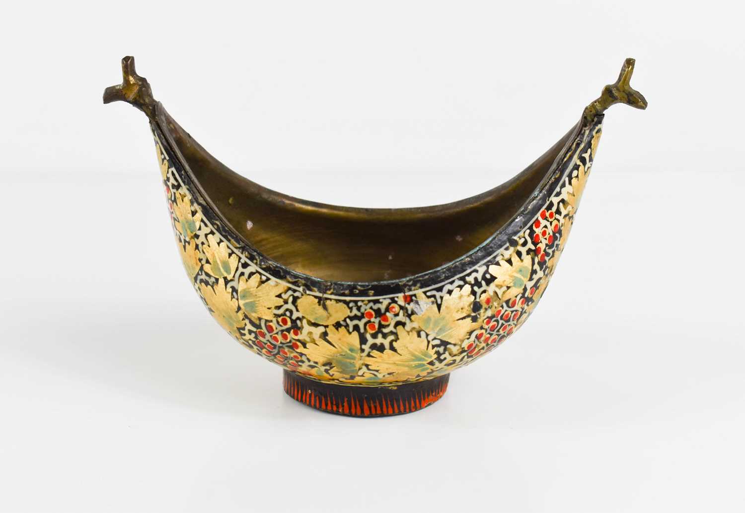 A lacquered bronze Kovsch, possibly Russian decorated with gilt vine leaves, red berries and