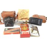 A group of collectables to include Kodak camera, Rolls Razor, first aid tin with contents, coins,