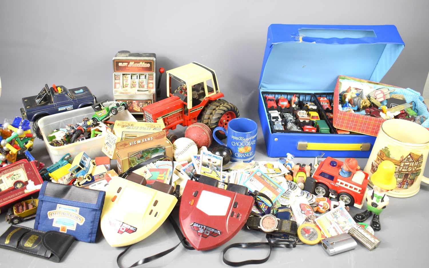 A large group of vintage toys to include star wars figures, two Tomytronic electronic games, Topps