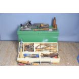 A vintage carpenters tool box with contents to include auger drill bits in a fitted treen case