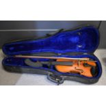 An antique cased violin and bow.