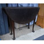 A large oak gateleg table, 73cm high, 90cm long, together with a bureau bookcase with glass doors.