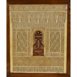 An intricate plasterwork plaque depicting one of the windows from the Palace of the Alhambra,