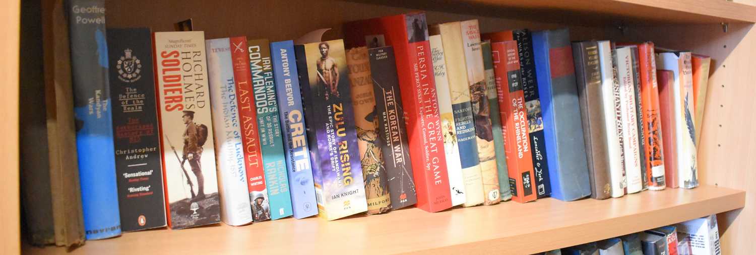 A quantity of hardback and paperback books, mainly of military interest, also including Biggles of