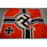 A WWII German banner flag and armband, the flag reputedly taken from the German Headquarters in