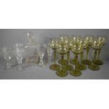 A set of German Mid Century green wine glasses, together with an Edwardian crystal engraved decanter