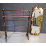 A Victorian mahogany towel rail with barley twist columns together with a gilt metal decorative wall
