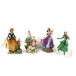 A group of four figurines, to include two fine porcelain limited edition Emily Bronte's Wuthering