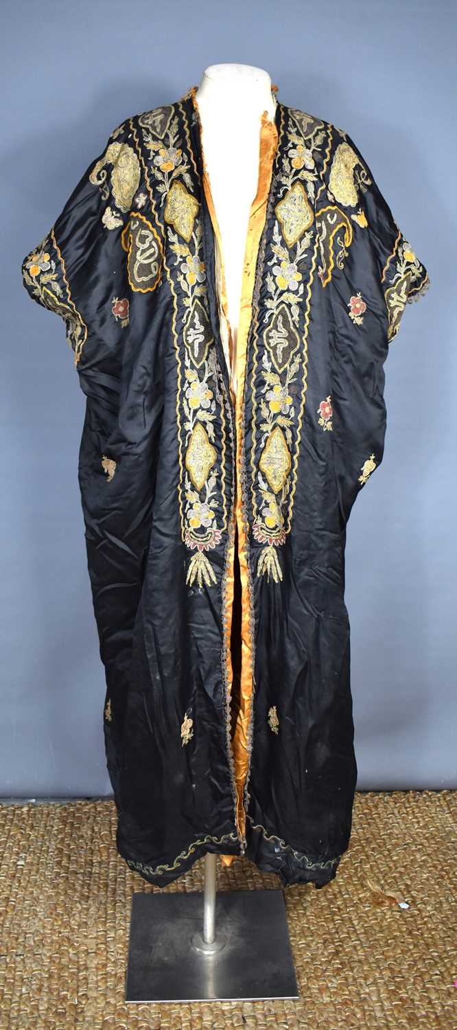 A vintage early 20th century Chinese silk robe, the background embroidered with metallic threads