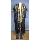A vintage early 20th century Chinese silk robe, the background embroidered with metallic threads