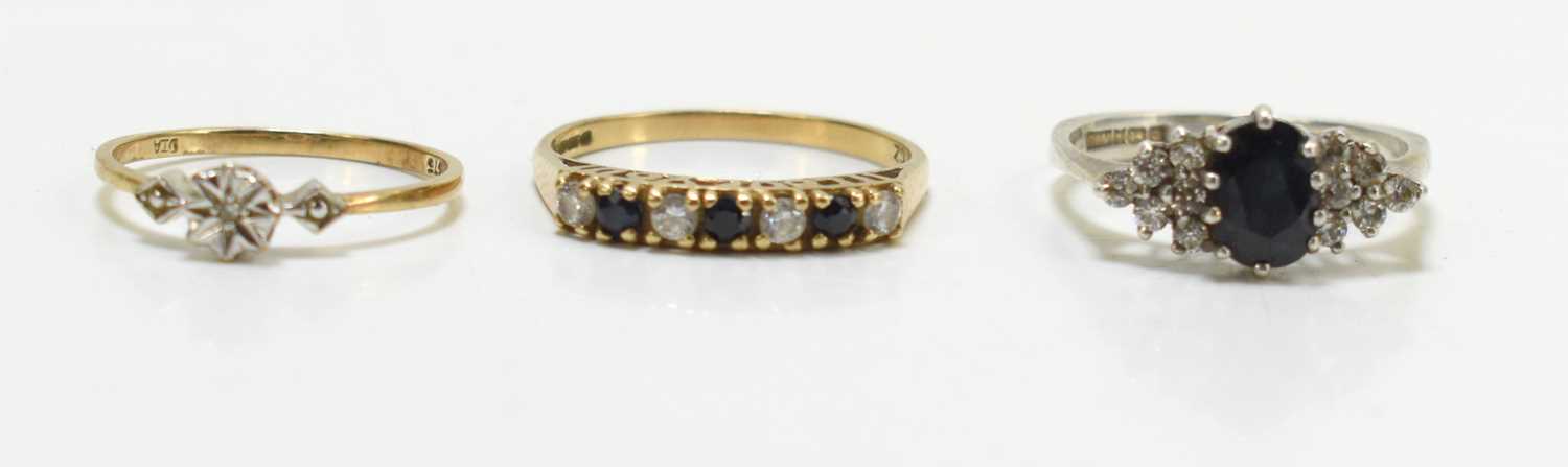 A 9ct gold ring, chip diamond in illusion setting, size J, 0.83g, a silver ring size L, and a 9ct