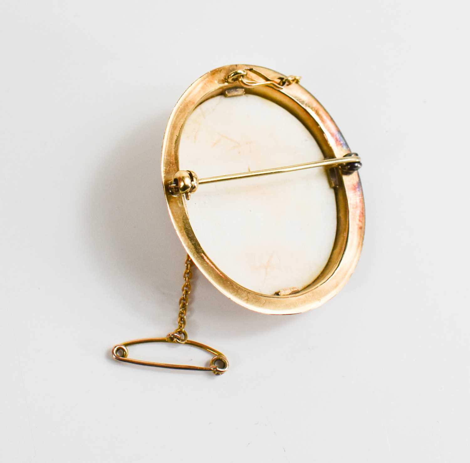 A Victorian cameo brooch, in a gold (tested as 9ct) setting, with safety chain, the female profile - Image 2 of 2