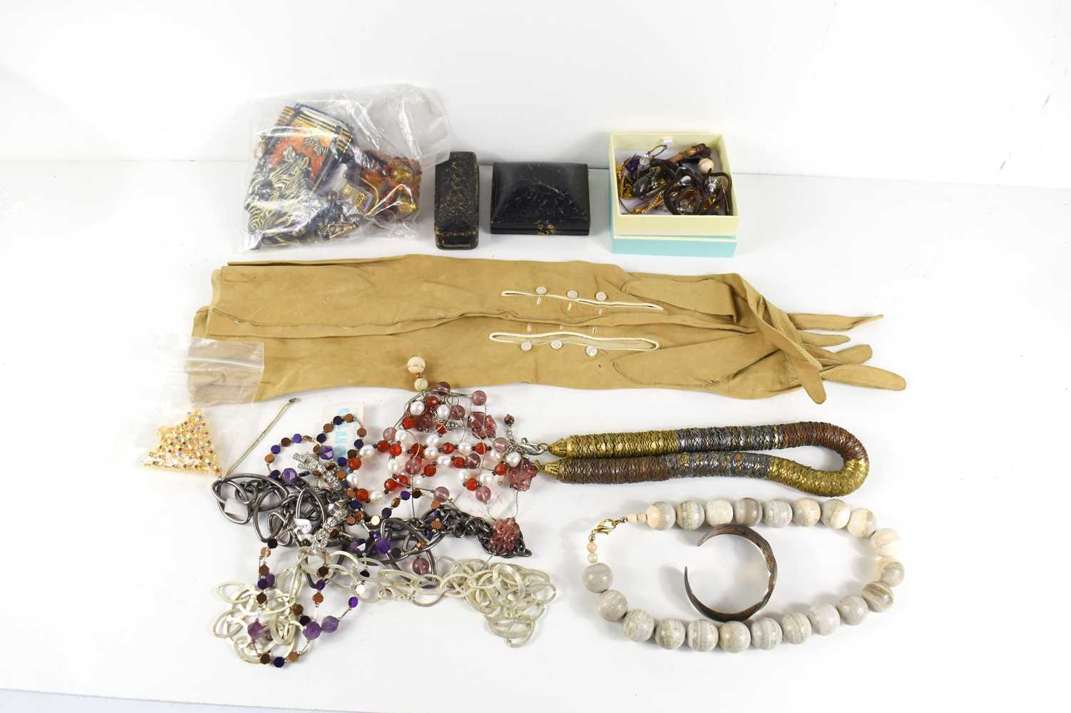 A group of vintage and designer costume jewellery including a David Detz zebra necklace and