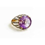 A Lehrer 9ct gold and Torusring amethyst and diamond ring, size O, 5.4g.