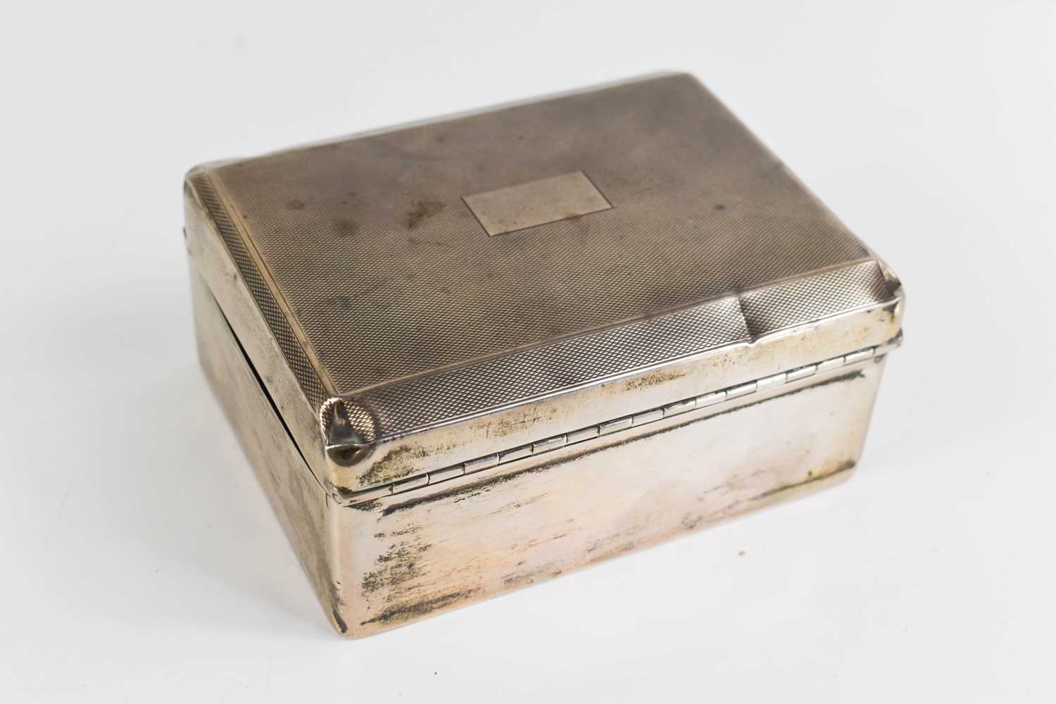 A silver cigarette box, with engine turned decoration, William Neale & Son Ltd, Birmingham 1931, - Image 2 of 2