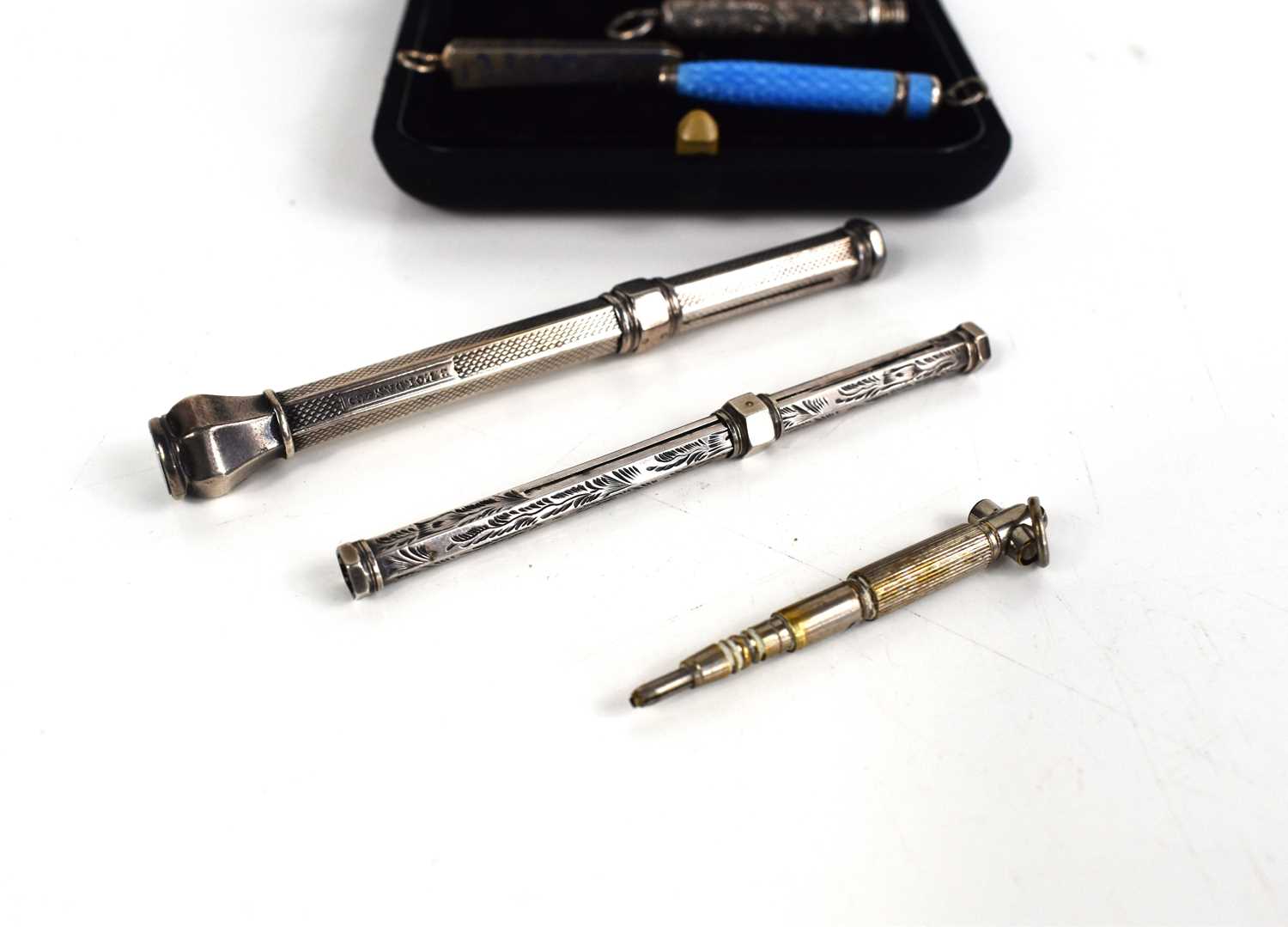 A selection of silver Victorian and later propelling pencils, including a small blue enamelled - Image 3 of 3