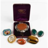 A group of antique and vintage brooches, to include a goldstone and silver example; the oval