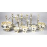 A group of silver plate to include a pair of candlesticks, a pair of candelabras, rose bowls and