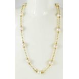 A 9ct gold and pearl necklace, each pearl united by chain form links, 33g.