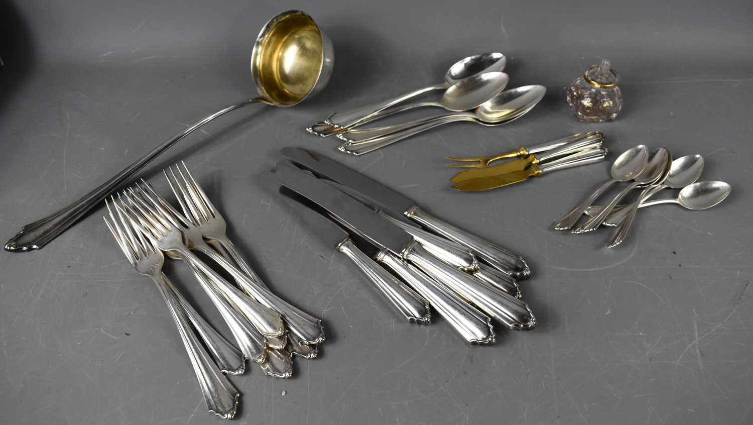 A part German silver tea service, 800 grade, including ladle, dinner knives, forks, spoons, and side