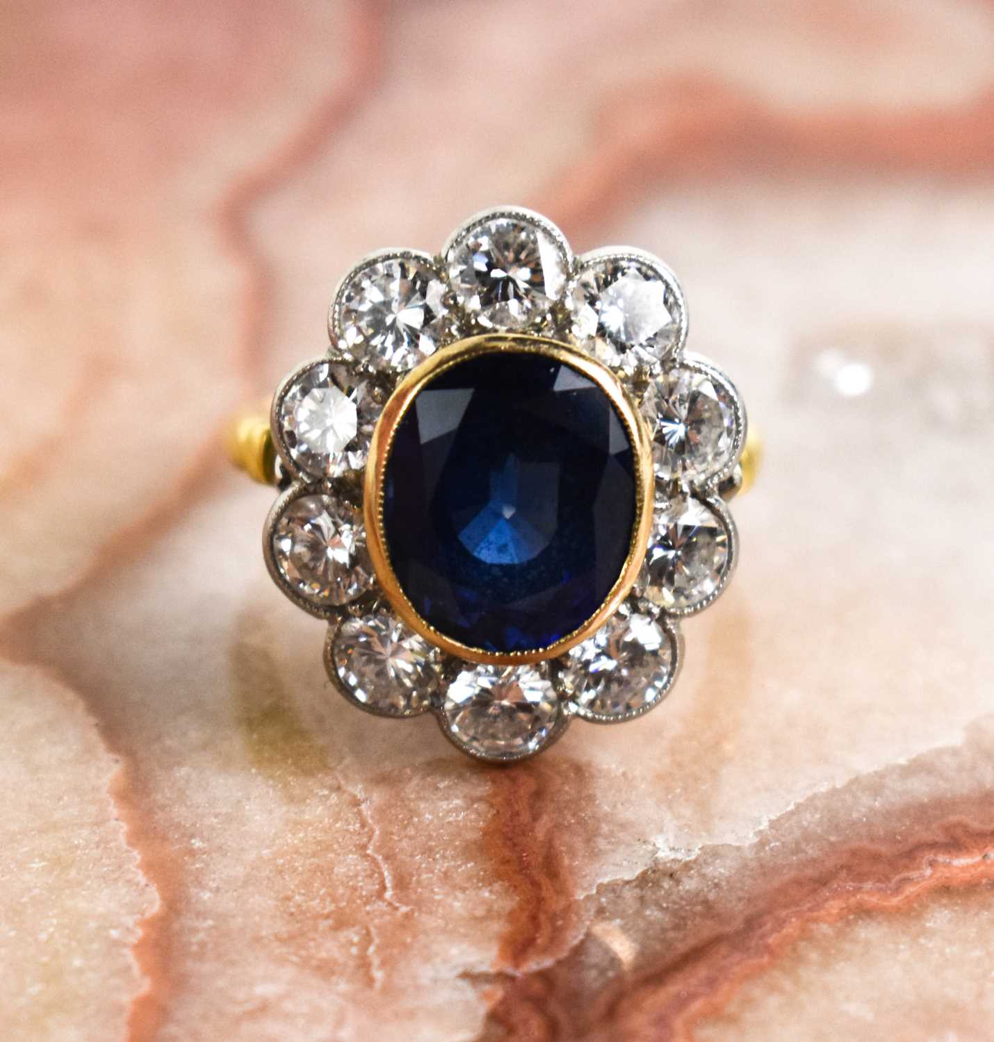 An 18ct yellow gold, sapphire and diamond ring, the central oval cut deep cornflower blue sapphire - Image 7 of 10