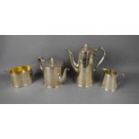 A Victorian silver tea and coffee set, with bright cut engraved decoration and pineapple finials,